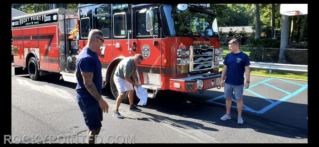 Commissioner  Dave Brewer along with Captain Jermey Freund and committee chairman Ex- Chief Kenny Staufer Christen the new rig into service.