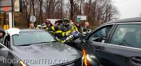 Members from R-4 & E-7 working to free driver of vehicle with Jaws of Life